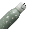 Owala FreeSip Twist 24oz in Clover Achiever, close-up of the sage green body with white clover and vine pattern and the white twist cap with sage carry string and dark carry string grip