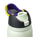 Owala FreeSip 32oz in RIP, flip cap open showing yellow-green FreeSip spout, purple lid interior with gray silicone seal, dark charcoal lid, on pale mint green body with white skeleton-hand pattern; glows in the dark
